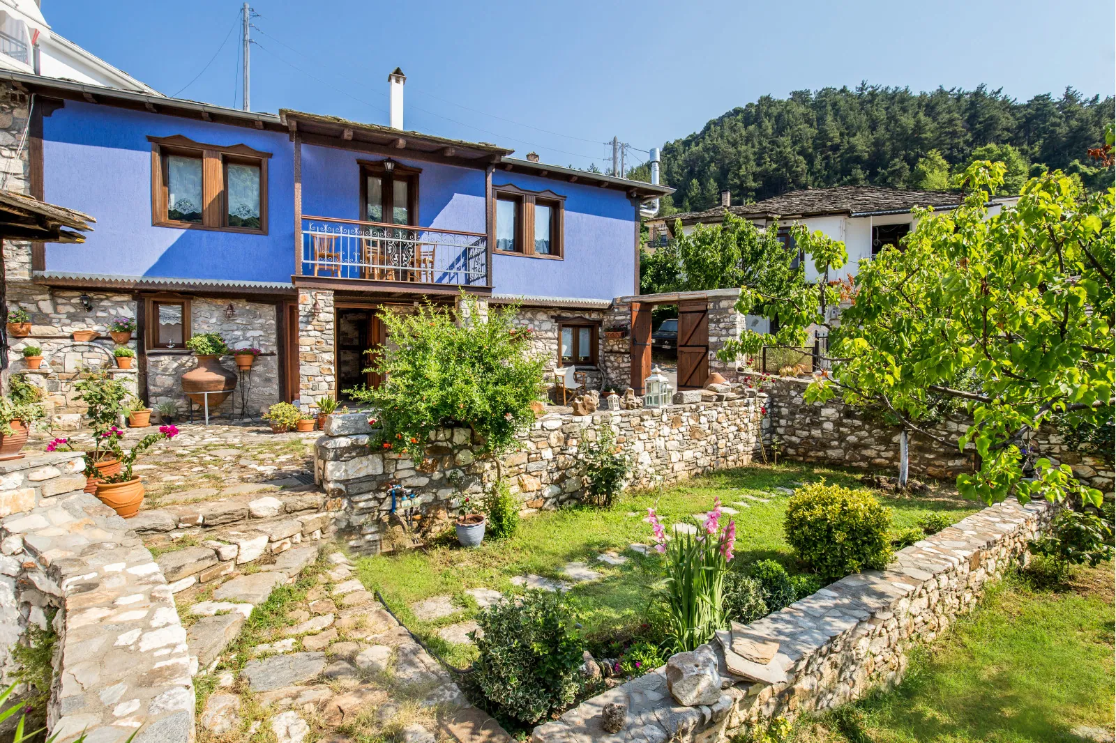 Exterior, courtyard, and village view 1 at Maroyda Stonehouse in Panagia, Thassos