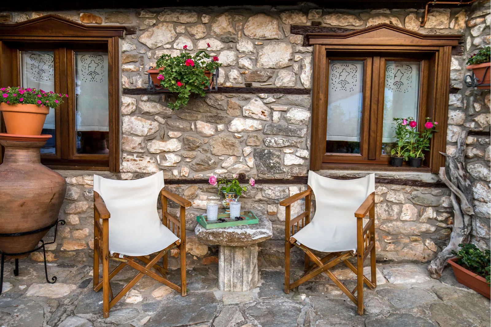 Exterior, courtyard, and village view 6 at Maroyda Stonehouse in Panagia, Thassos