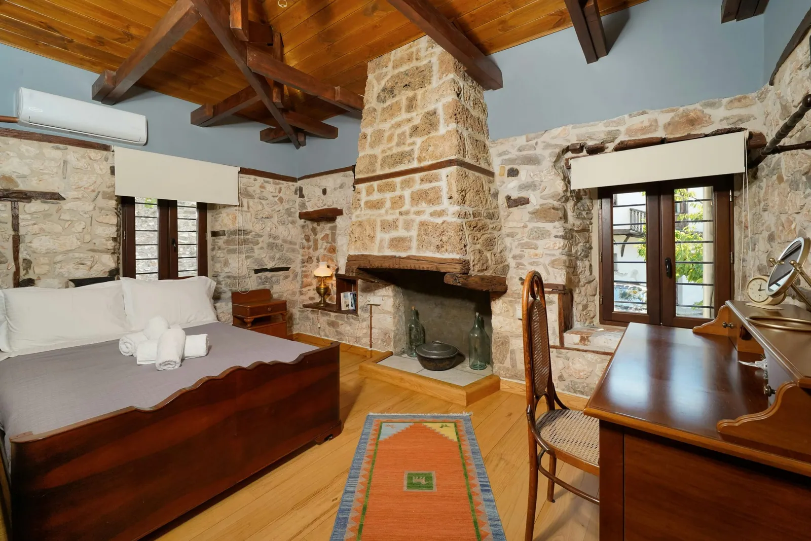 Bedroom and restored interior 16 at Maroyda Stonehouse in Panagia, Thassos
