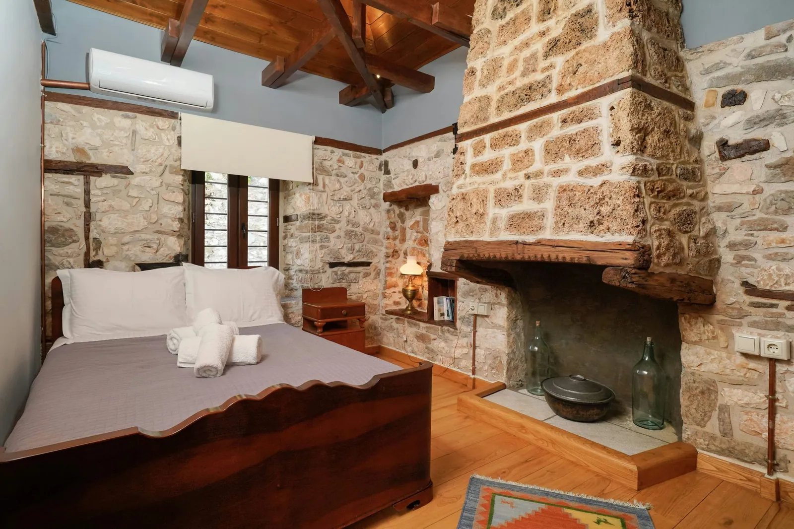 Bedroom and restored interior 11 at Maroyda Stonehouse in Panagia, Thassos