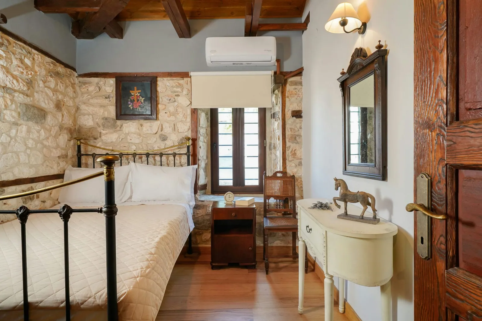 Bedroom and restored interior 1 at Maroyda Stonehouse in Panagia, Thassos